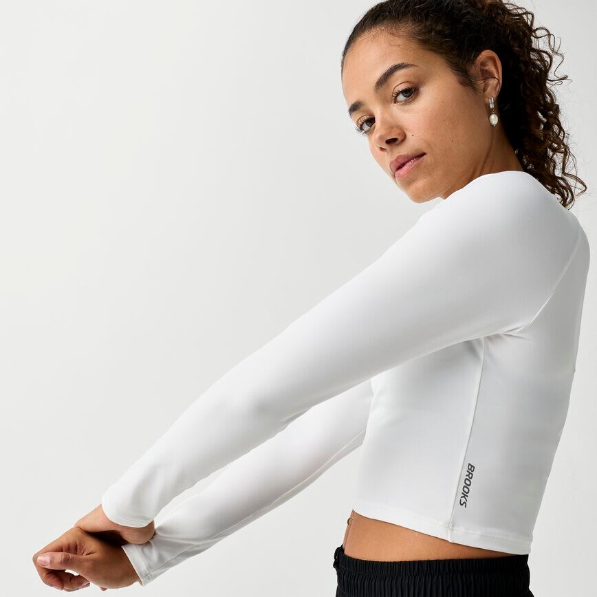f03f57b4_221797-100-d1-womens-luxe-crop-long-sleeve-running-tops